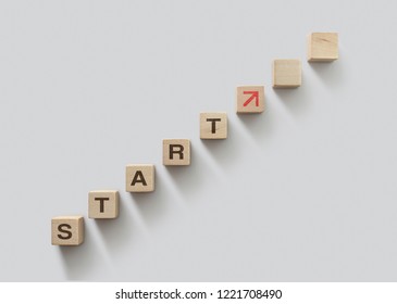 Wooden Blocks Arranged In Stair Shape With The Word START. Start, Start Up, New Career Or New Business, Start To Success Or Mindset Concept.