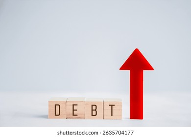 Wooden blocks with DEBT word and red up arrow, financial crisis, inflation, debt growth concept