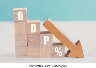Wooden blocks with GDP% and orange down arrow, impacts of Covid-19 global economy financial crisis, gross domestic product falling concept - Shutterstock ID 1809953485