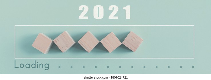 Wooden Blocks In Loading Bar For 2021 Goal Planning Business Concept