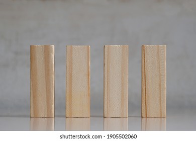 Wooden Blocks On Reflective Marble With Concrete Background With Copy Space - Suitable As Conceptual Graphic Resource For Four Letter Word Or Number