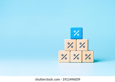 Wooden blocks with percentage sign, interest rate decline, investment reduce or Sales discount concept, copy space - Shutterstock ID 1911496039