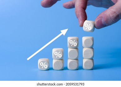 Wooden blocks with percentage sign,represent in meanings of interest rate increase, performance increase, sales increase, business growth , percent growth
