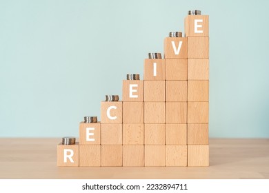 Wooden blocks with "RECEIVE" text of concept and coins. - Shutterstock ID 2232894711