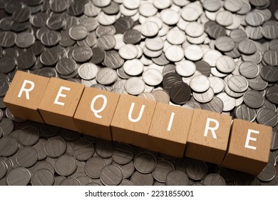 Wooden blocks with "REQUIRE" text of concept and coins. - Shutterstock ID 2231855001
