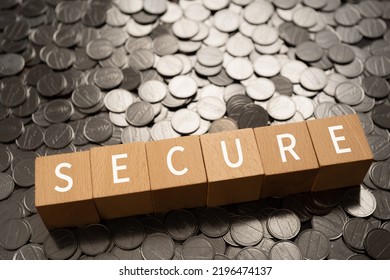 Wooden blocks with "SECURE" text of concept and coins. - Shutterstock ID 2196474137