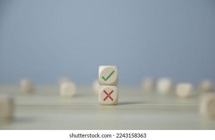 Wooden blocks show check marks and are wrong. concepts decisions, votes, and thinking yes or no. Business options for difficult situations true and false symbols - Shutterstock ID 2243158363