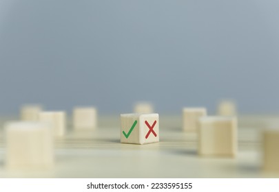 Wooden blocks show checks marks and are wrong. concepts decisions, votes, and thinking yes or no. Business options for difficult situations true and false symbols - Shutterstock ID 2233595155