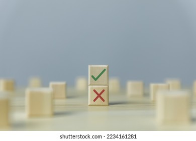 Wooden blocks show checks marks and are wrong. concepts decisions, votes, and thinking yes or no. Business options for difficult situations true and false symbols - Shutterstock ID 2234161281
