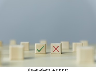 Wooden blocks show checks marks and are wrong. concepts decisions, votes, and thinking yes or no. Business options for difficult situations true and false symbols - Shutterstock ID 2234641439