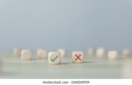 Wooden blocks show checks marks and are wrong. concepts decisions, votes, and thinking yes or no. Business options for difficult situations true and false symbols - Shutterstock ID 2240269939