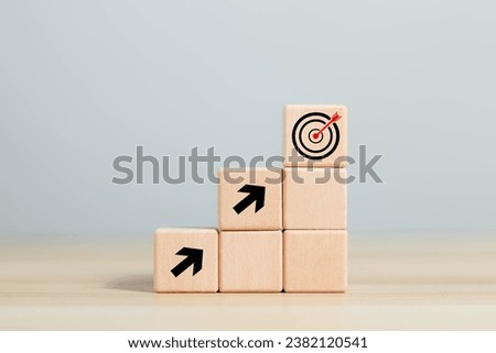 Wooden blocks showing planning goals, business investment concept, strategy, business, vision, precision, digital, objectives, customers, objectives, value, goals, investment growth and development.