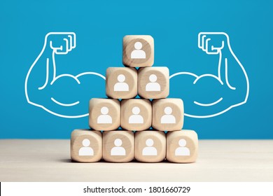 Wooden Blocks Stacked As Pyramid Hierarchy With People Icons. Power Of Teamwork, Solidarity Or Cooperation In Business Concept.