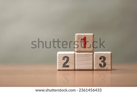 Wooden blocks stacking as a podium on white background. Success, win, winner, victory or top ranking concept.