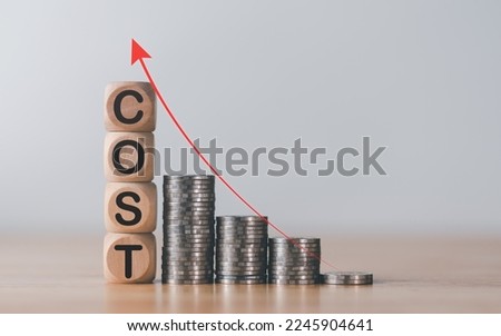wooden blocks and stacks of coins,Consistently Higher Inflation Concept,financial crisis affecting people all over the world,Currency problems that affect costs and prices of products