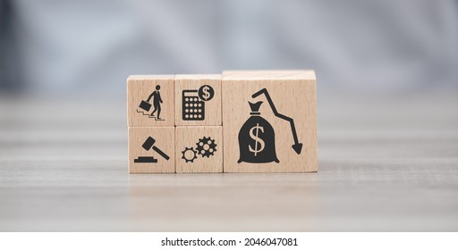 Wooden blocks with symbol of bankruptcy concept - Shutterstock ID 2046047081