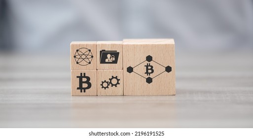 Wooden blocks with symbol of blockchain technology concept - Shutterstock ID 2196191525