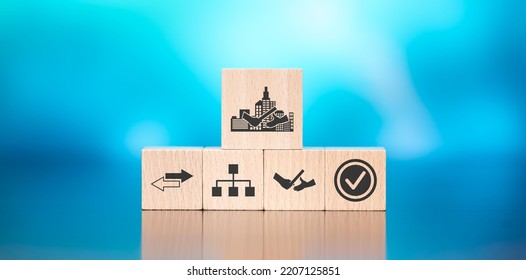 Wooden Blocks With Symbol Of Business Transition Concept On Blue Background