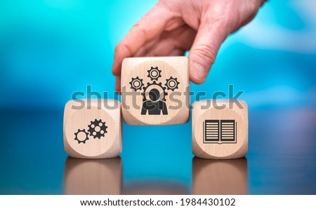 Wooden blocks with symbol of competence concept on blue background