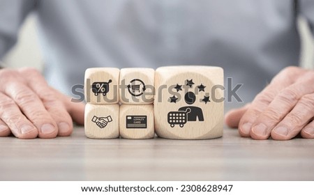Wooden blocks with symbol of customer loyalty concept