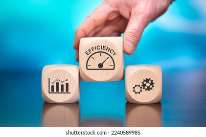Wooden blocks with symbol of efficiency concept on blue background - Shutterstock ID 2240589985