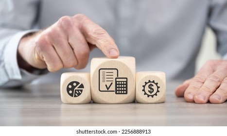 Wooden blocks with symbol of financial audit concept - Shutterstock ID 2256888913