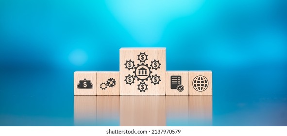 Wooden Blocks With Symbol Of Government Aid Concept On Blue Background