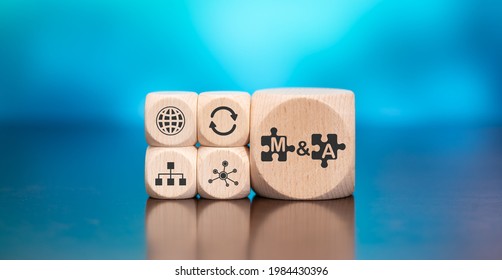Wooden blocks with symbol of m and a concept on blue background - Shutterstock ID 1984430396