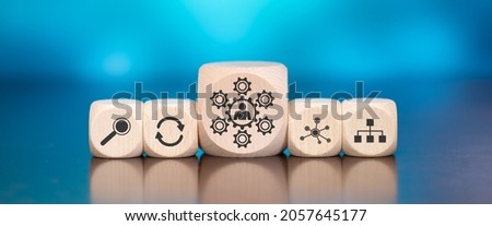 Wooden blocks with symbol of skills concept on blue background