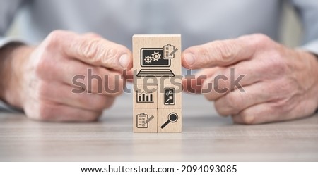 Wooden blocks with symbol of software testing concept