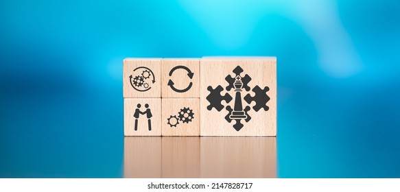Wooden blocks with symbol of strategic alliance concept on blue background