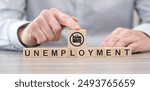 Wooden blocks with symbol of unemployment concept