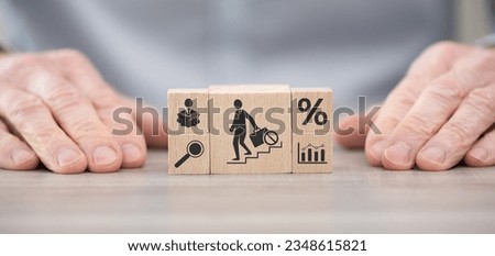 Wooden blocks with symbol of unemployment concept