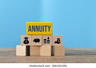 Wooden Blocks With Text ANNUITY And Money Symbols