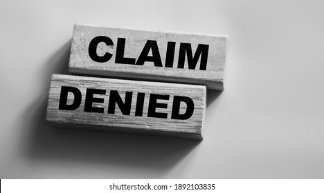 Wooden Blocks with the text: Claim Denied. Insurance Business concept. - Shutterstock ID 1892103835