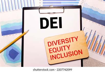 Wooden Blocks With Text DEI On Yellow Background. Dei - Short For Diversity Equity Inclusion.