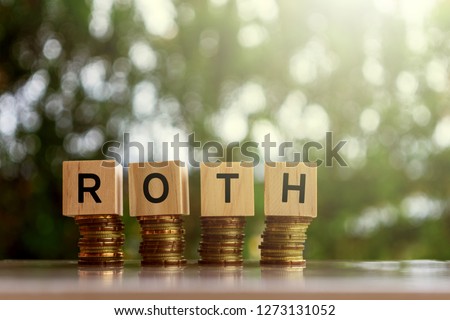 Wooden blocks with text ROTH. Business and finance concept.