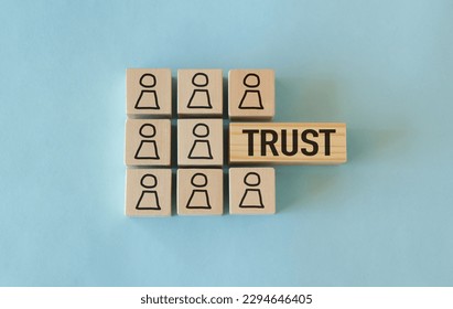 Wooden Blocks with the text: Trust, Building trust in business concept.