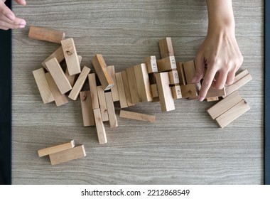 Wooden Blocks From Tower Constructed Game Fall Scattered All Over The Table. Top View