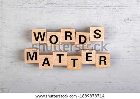 wooden blocks  in a white and grey board with the text words matter