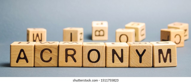 Wooden blocks with the word Acronym. Abbreviation from the initial components of a phrase or a word. - Shutterstock ID 1511755823