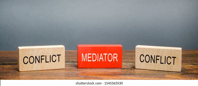 Wooden Blocks With Word Mediator And Conflict. Settlement Of Disputes. Conflict Resolution And Mediation. Third Party, Intermediary. Solution Problem.