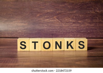 Wooden Blocks With The Word Stonks. Business And Finance Concept.