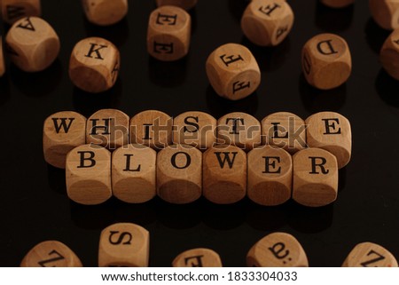 Wooden blocks with the word Whistle blower