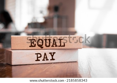 Wooden blocks with words 'Equal Pay'. Business concept