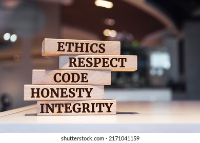 Wooden blocks with words 'ethics, respect, code, honesty, integrity'. code of conduct - Shutterstock ID 2171041159