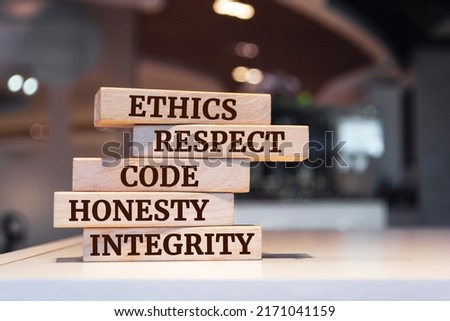 Wooden blocks with words 'ethics, respect, code, honesty, integrity'. code of conduct