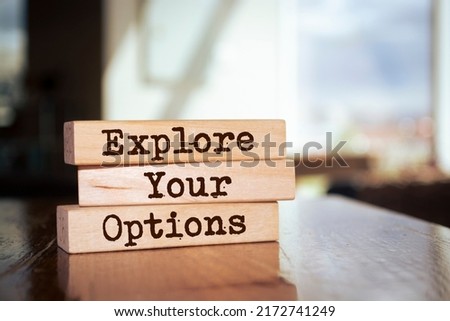 Wooden blocks with words 'Explore Your Options'.