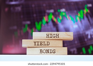 Wooden blocks with words 'High-Yield Bonds'. Business concept