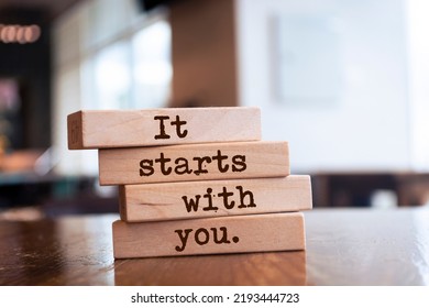 Wooden blocks with words 'It starts with you'. - Shutterstock ID 2193444723
